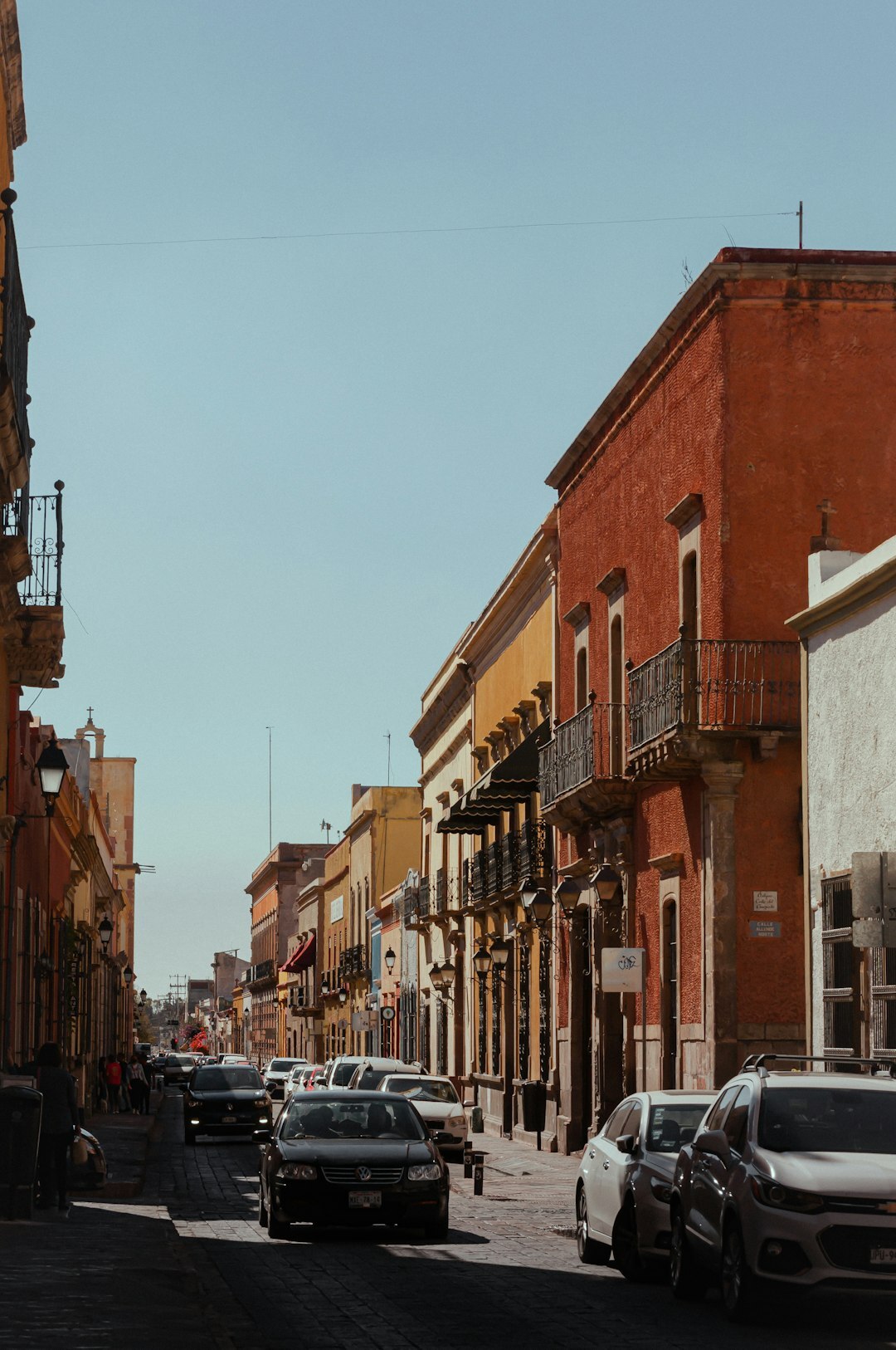 Street in downtown Santiago mixing colonial and modern buildings